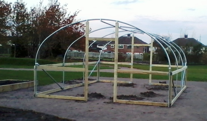 Polytunnel with timber rails